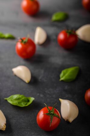 Tomato garlic basil background, product photography, ready for advertisingの写真素材
