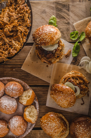 Barbecue pulled pork burger, slow cook delicious meat with pickless and onion, homemade donutsの写真素材