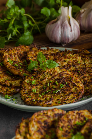 Potato pancakes fried with garlic and herbsの写真素材