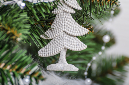 Christmas tree traditional, gifts and lights, white treeの写真素材