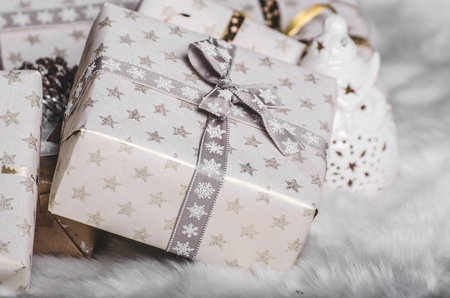 Christmas tree traditional, gifts and lights, white treeの写真素材