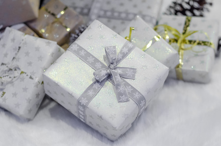 Christmas tree traditional, gifts and lights, white treeの写真素材