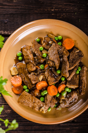 Pork medallions with vegetable and soy garlic sauce, food photography, fresh ingredienceの写真素材