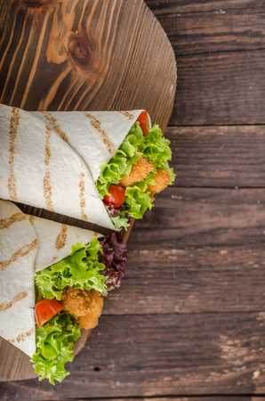 Grilled tortilla with chicken, mayo and tomato ketchuGrilled tortilla chicken, lettuce, homemade mayo and barbeque sauce, food photographyの写真素材