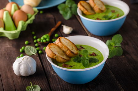 Pea soup, fresh herbs and bacon, food photographyの写真素材