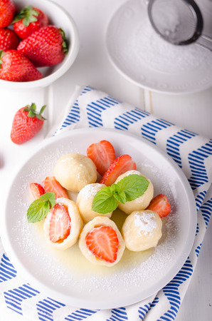 Stuffed strawberry dumplings, delish dessert with herbsの写真素材