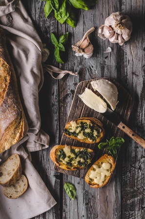 Garlic herbs toast with fresh mozzarella, food photography, vintage photographyの写真素材