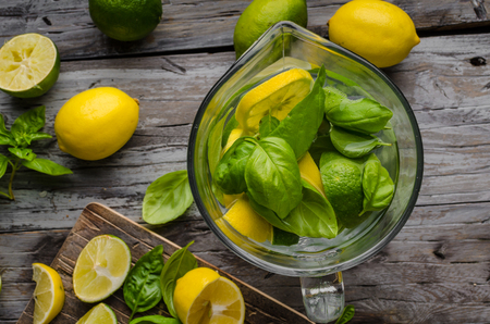 Fresh lime and lemons, ready to serve in drink, food photography, rustic, wood board and tableの写真素材