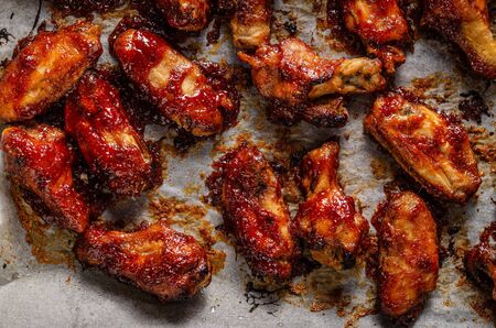 Spicy chicken wings with barbecue sauce, delicious and simple foodの写真素材