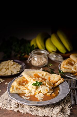 Beautiful and delicous dessert with homemade caramal sauce and bananaの写真素材