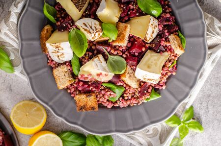 Beautiful salad from buckwheat and beet with grilled fishの写真素材
