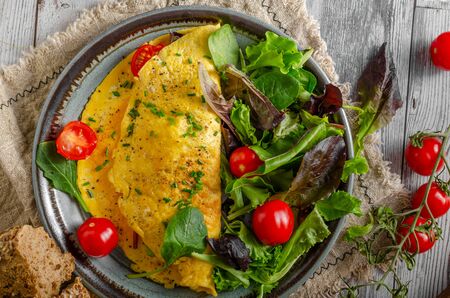 Delicious and simple egg omelette with herbsの写真素材