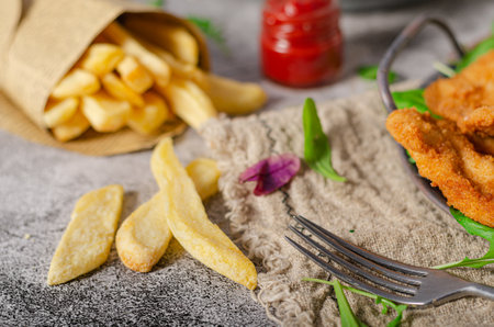Delicious tender chicken chnitzel with homemade french-fries