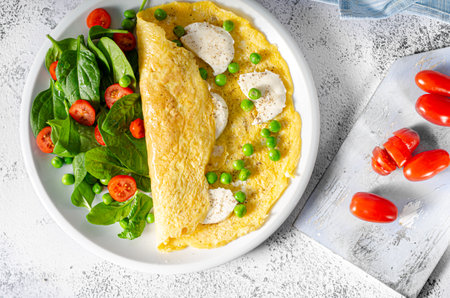 Bio heathy food - fresh omelet with salad, wholegrain bread and cheese