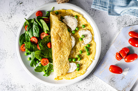 Bio heathy food - fresh omelet with salad, wholegrain bread and cheeseの写真素材