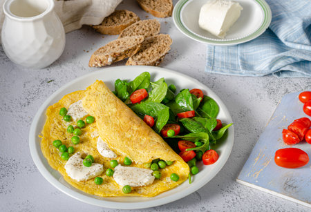 Bio heathy food - fresh omelet with salad, wholegrain bread and cheeseの写真素材