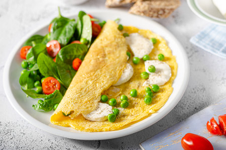 Bio heathy food - fresh omelet with salad, wholegrain bread and cheeseの写真素材