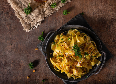 Delicious organic pappardelle with roasted garlic and chilli flakesの写真素材