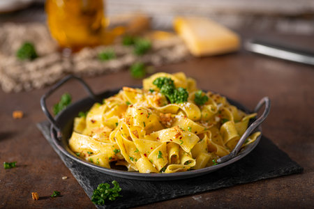Delicious organic pappardelle with roasted garlic and chilli flakesの写真素材