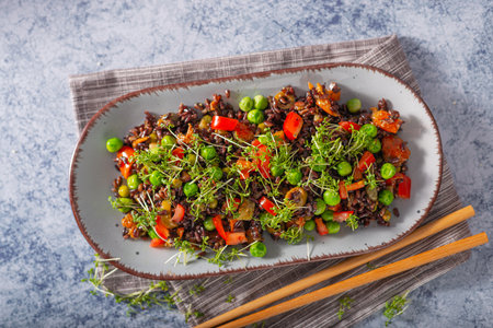 Delicious and organic black rice salad with microgreensの写真素材