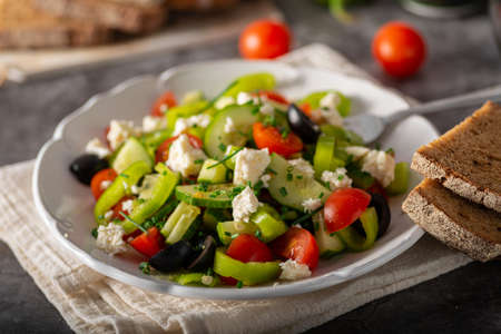 Delicious and heathy salad with olives and feta cheeseの写真素材
