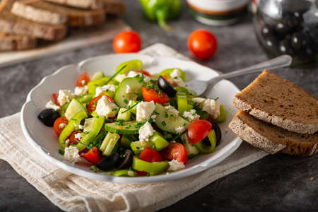Delicious and heathy salad with olives and feta cheeseの写真素材