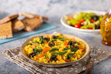 Hommemade risotto with spinach, garlic and olivesの写真素材