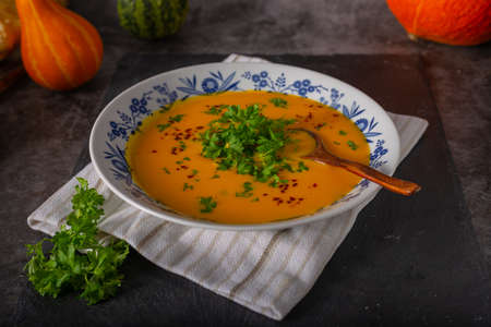 Delicious sweet soup with chilli and herbsの写真素材