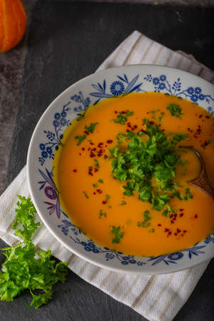 Delicious sweet soup with chilli and herbsの写真素材