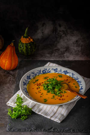 Delicious sweet soup with chilli and herbsの写真素材