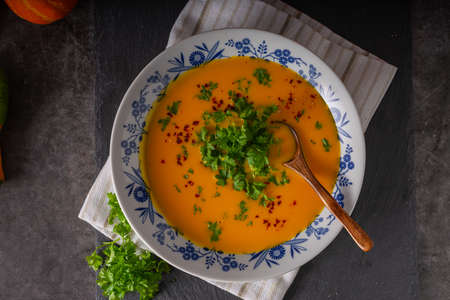 Delicious sweet soup with chilli and herbsの写真素材