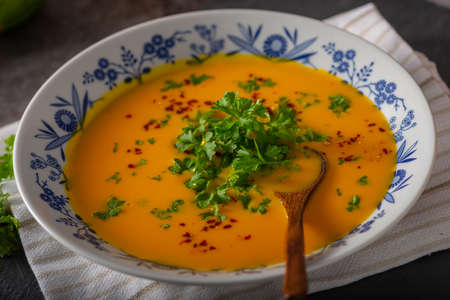 Delicious sweet soup with chilli and herbsの写真素材