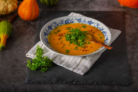 Delicious sweet soup with chilli and herbsの写真素材