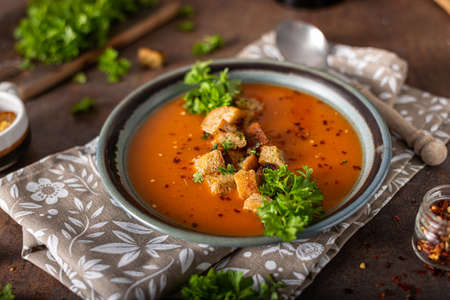 Goulash soup with crispy bread, garlic herbsの写真素材