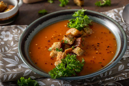Goulash soup with crispy bread, garlic herbsの写真素材