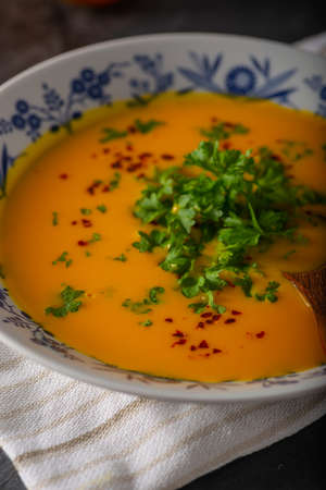 Delicious sweet soup with chilli and herbsの写真素材