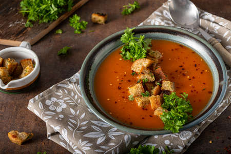 Goulash soup with crispy bread, garlic herbsの写真素材