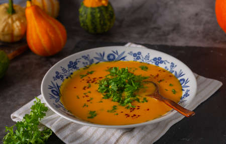 Delicious sweet soup with chilli and herbsの写真素材
