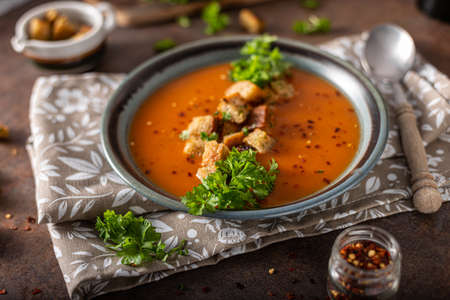 Goulash soup with crispy bread, garlic herbsの写真素材