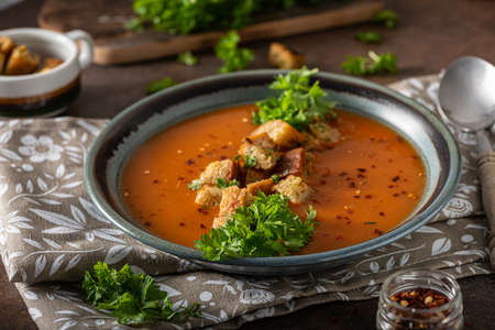 Goulash soup with crispy bread, garlic herbsの写真素材