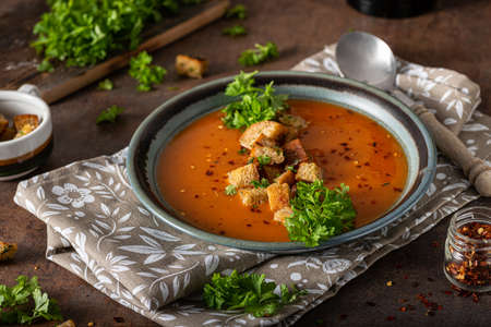 Goulash soup with crispy bread, garlic herbsの写真素材