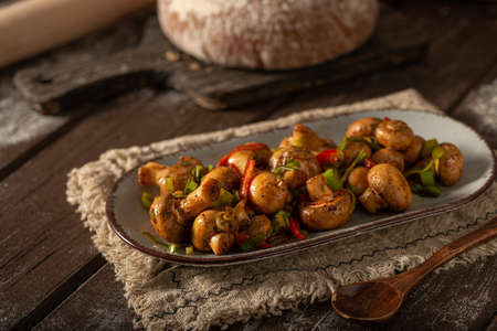 Mushroom salad with chilli, peppers and herbsの写真素材