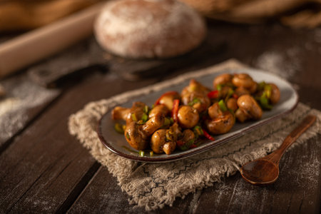 Mushroom salad with chilli, peppers and herbsの写真素材