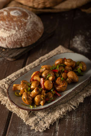 Mushroom salad with chilli, peppers and herbsの写真素材