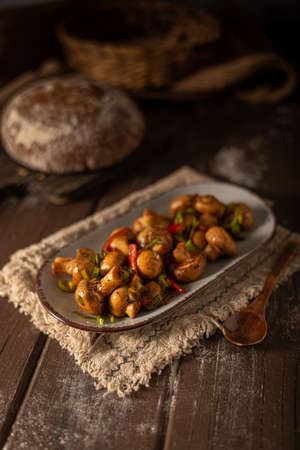 Mushroom salad with chilli, peppers and herbsの写真素材