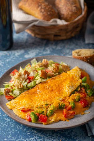 Delicious omelette from organic eggs with peppers and cheddarの写真素材