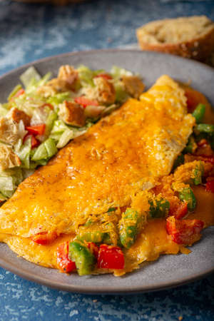 Delicious omelette from organic eggs with peppers and cheddarの写真素材
