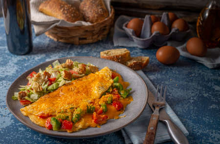 Delicious omelette from organic eggs with peppers and cheddarの写真素材