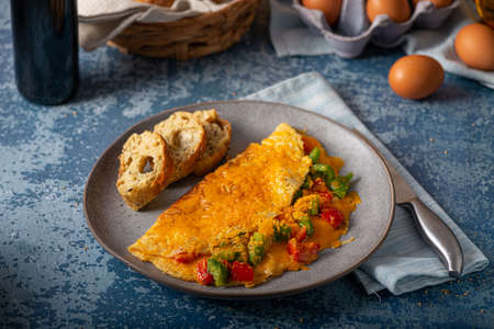 Delicious omelette from organic eggs with peppers and cheddarの写真素材