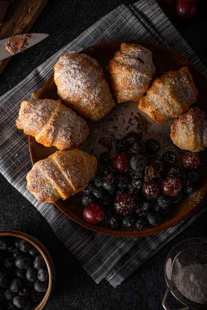 Chocolate filled pastry with berries, all homemadeの写真素材